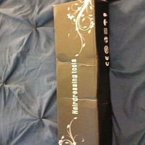 A HAIR CURLER WITH CORD